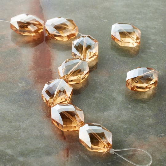 12 Packs: 9 ct. (108 total) Amber Oval Glass Beads, 18mm by Bead Landing™